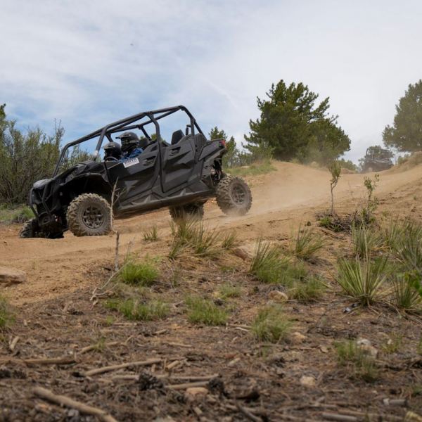 a truck driving down a dirt road