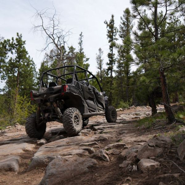 a truck driving down a dirt road