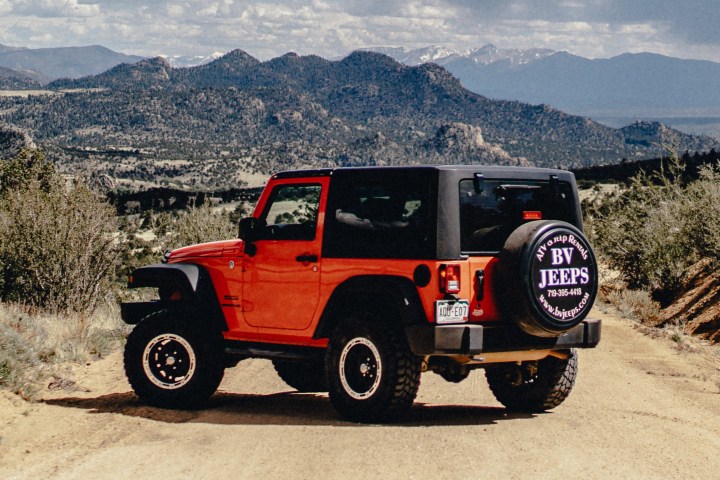 a truck with a mountain in the background