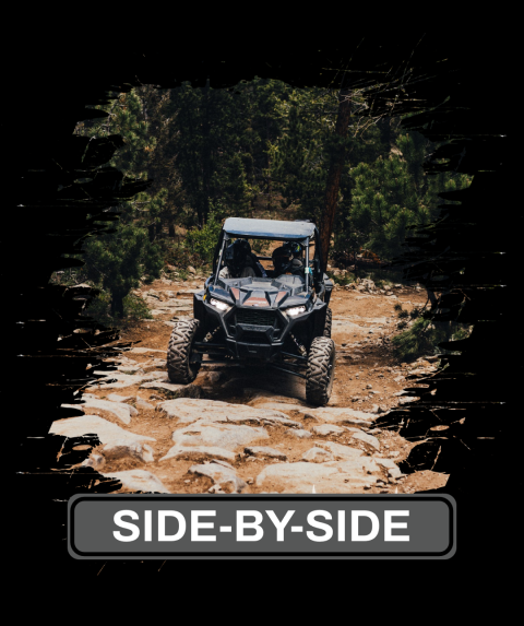 a person riding a motorcycle down a dirt road
